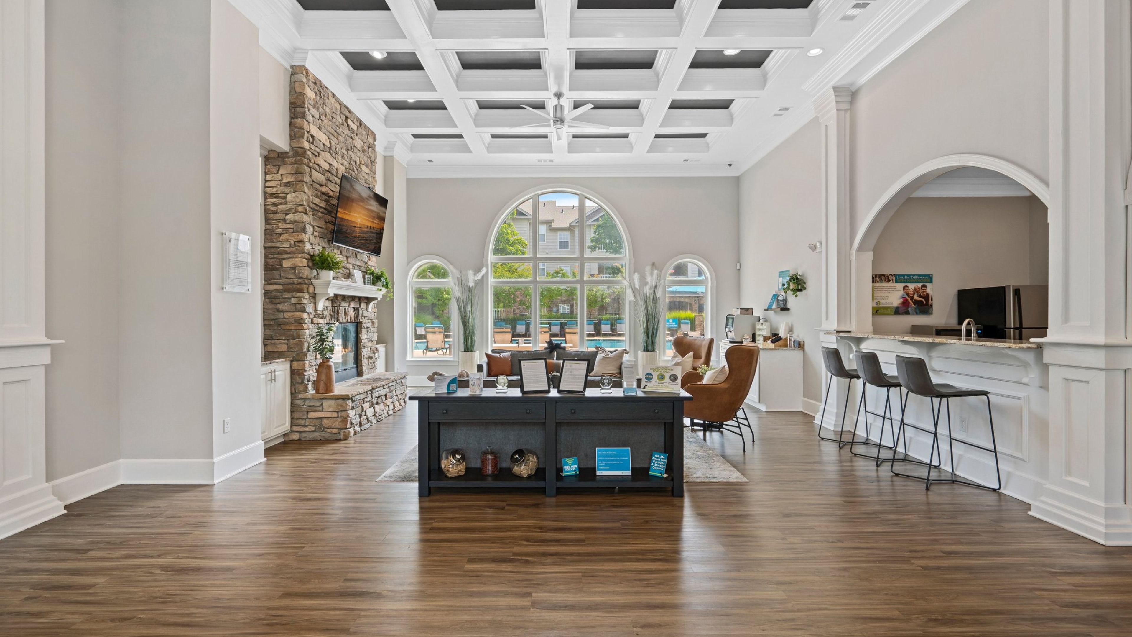 Hawthorne at the Meadows beautiful clubhouse lounge amenity for residents with a fireplace, large TV and seating