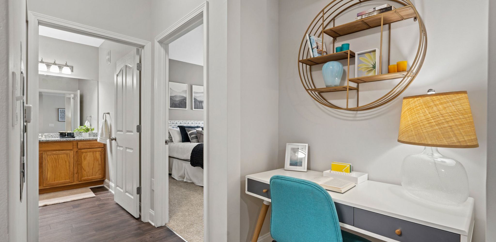Hawthorne at the Meadows apartment living area with desk nook and hallway looking towards bathroom and bedroom