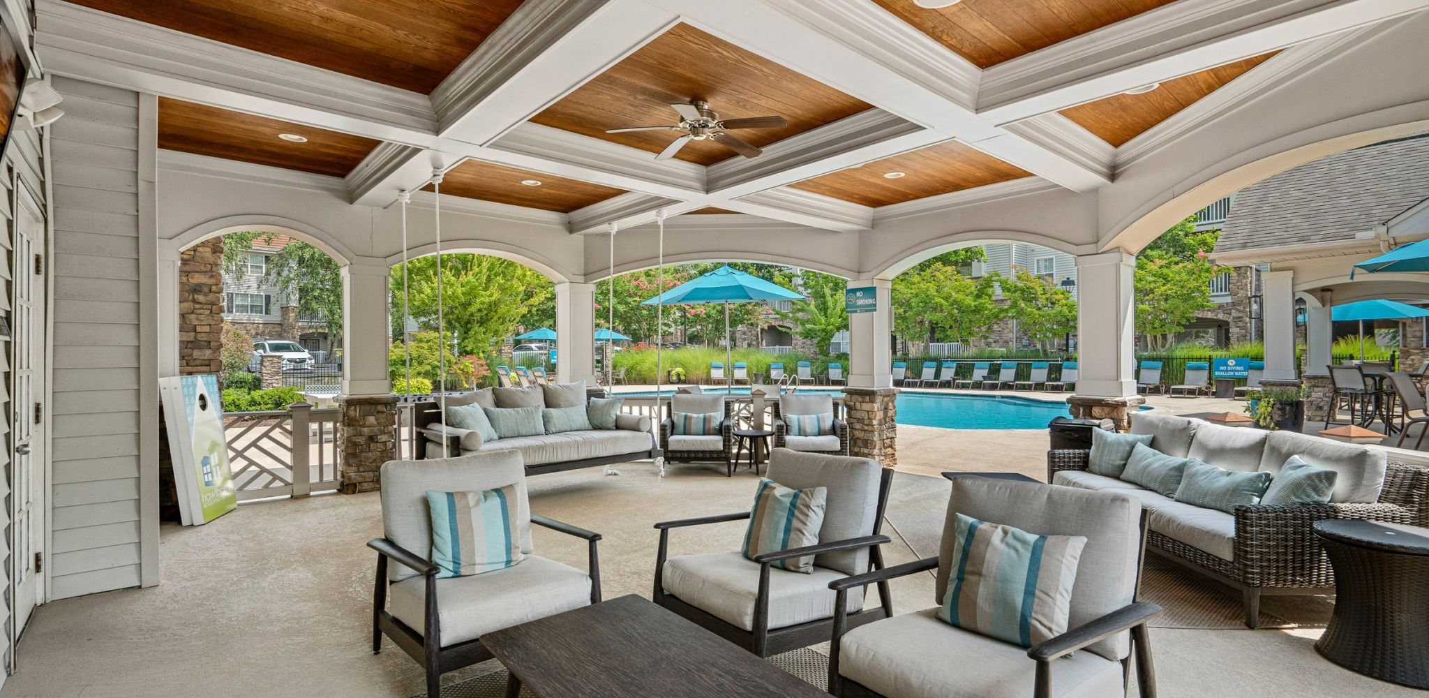 Hawthorne at the Meadows outdoor covered patio with seating looking out towards the pool